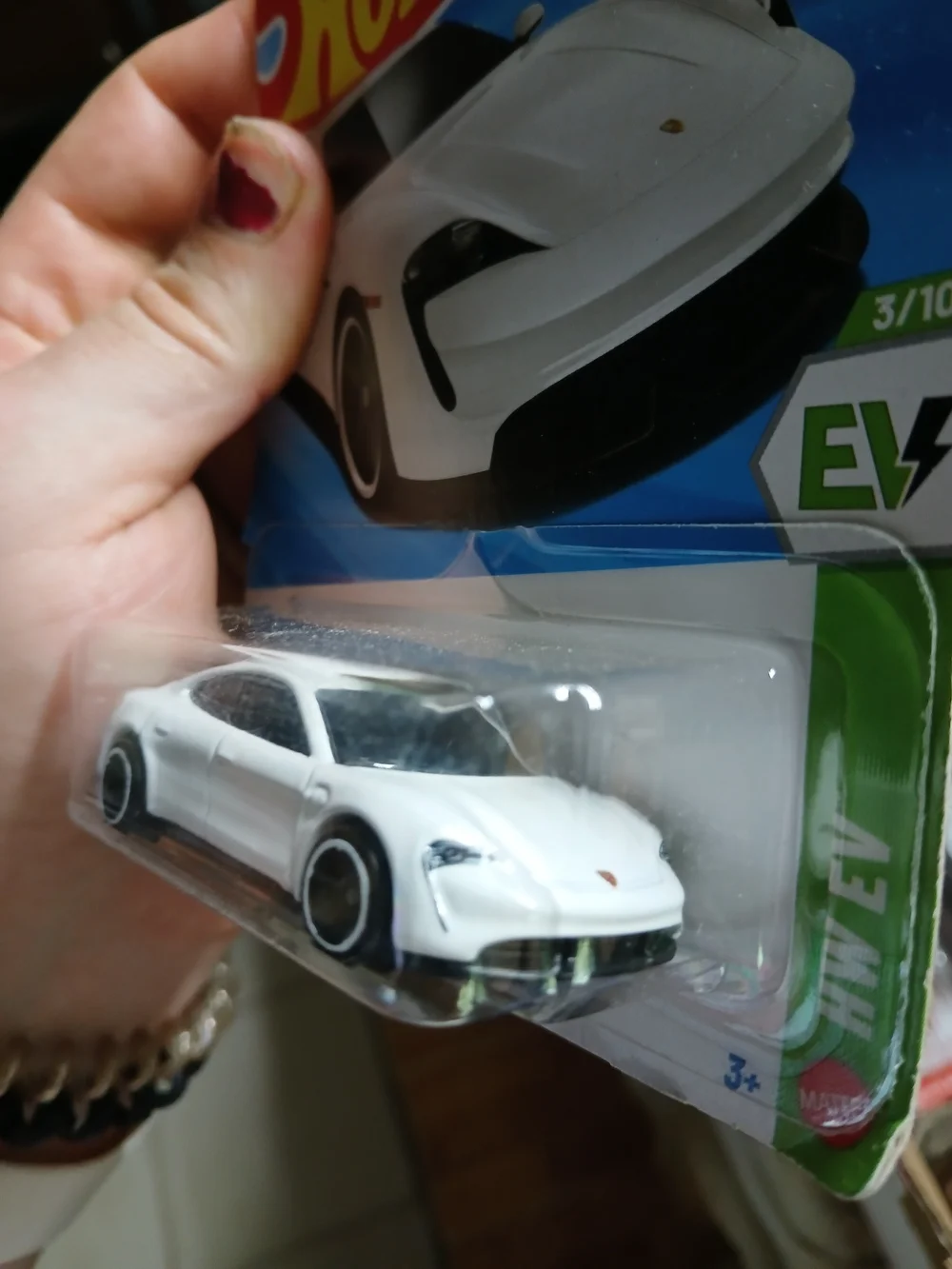 white Hot Wheels Porsche Taycan Turbo S from the 2026 HW EV series (3/10, number